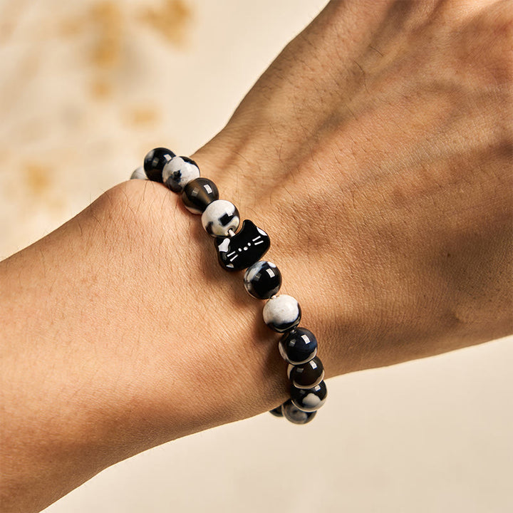 Bracciale Buddha Stones con agata di fuoco bianca e nera e gatto - image 3