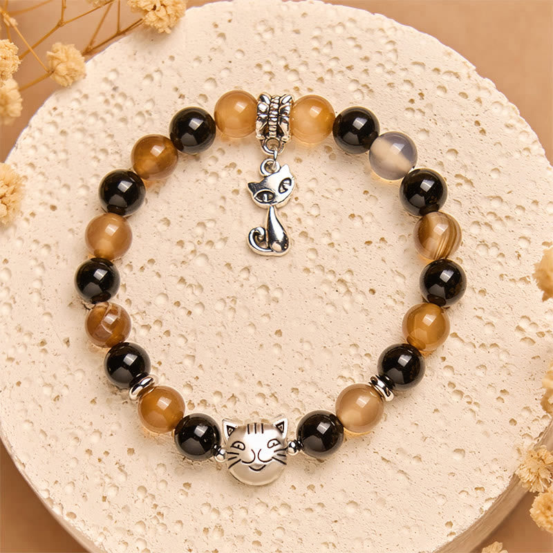 Braccialetto di protezione in onice nero con agata striata marrone chiaro e tartaruga Buddha Stones - image 1