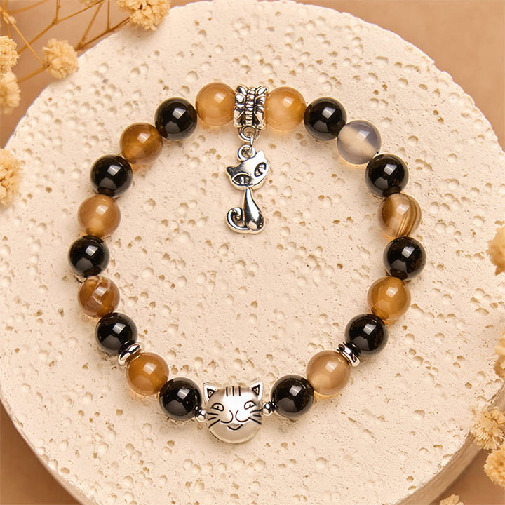 Braccialetto di protezione in onice nero con agata striata marrone chiaro e tartaruga Buddha Stones - image 1