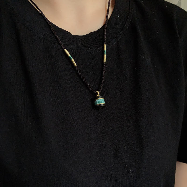 Collana con ciondolo della pace in legno di ebano e turchese Buddha Stones - image 8