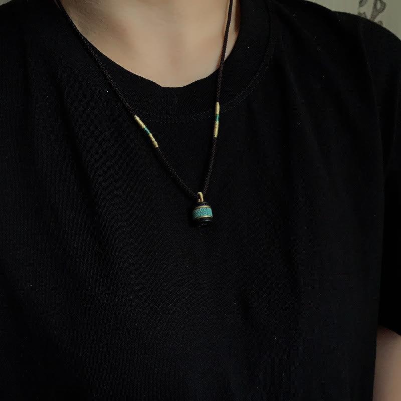 Collana con ciondolo della pace in legno di ebano e turchese Buddha Stones - image 5