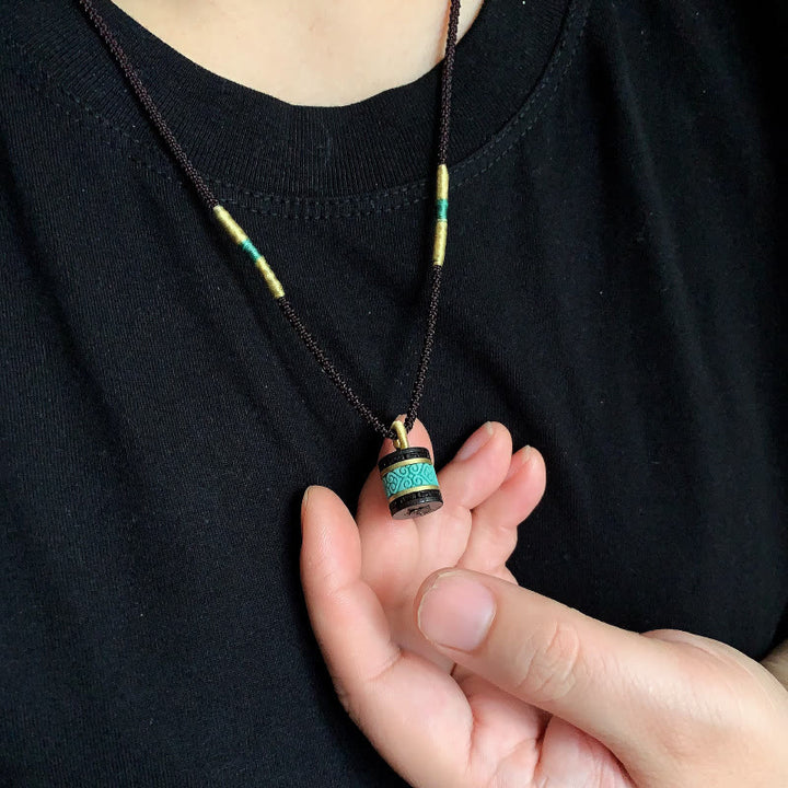 Collana con ciondolo della pace in legno di ebano e turchese Buddha Stones - image 6