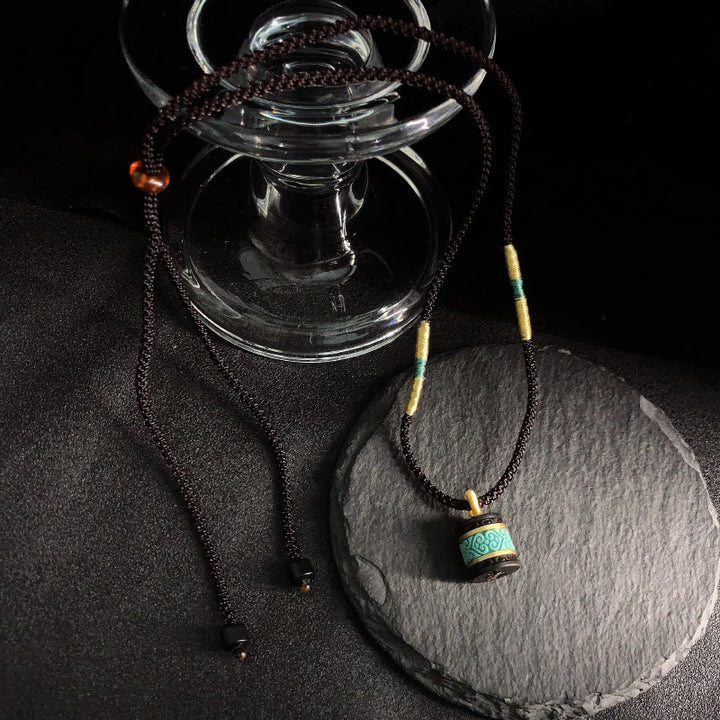 Collana con ciondolo della pace in legno di ebano e turchese Buddha Stones - image 3