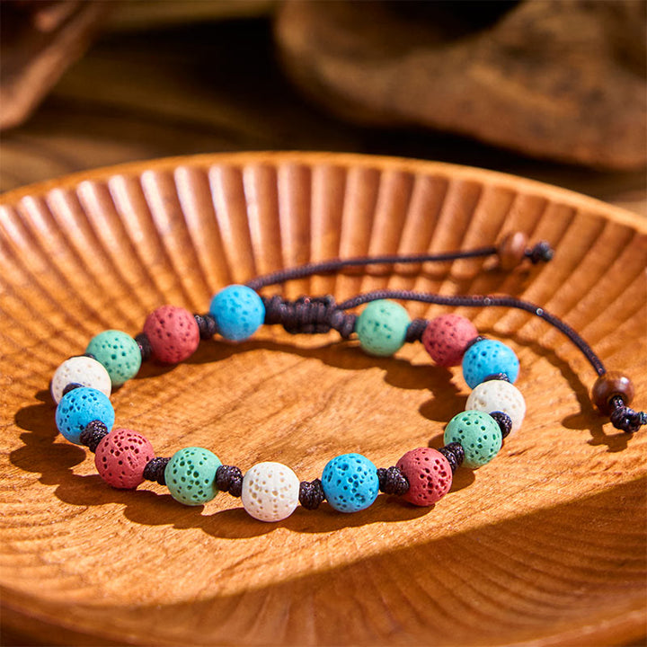 Braccialetto di supporto in pietra lavica colorata Buddha Stones - image 13