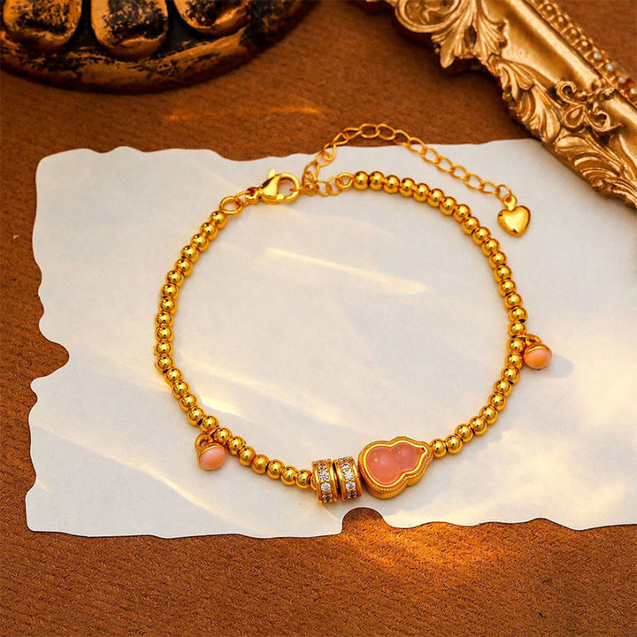 Bracciale della ricchezza con perline di zucca placcate in rame e ottone Buddha Stones - image 3