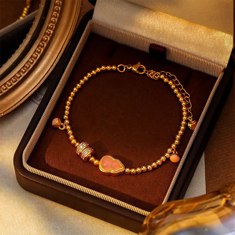Bracciale della ricchezza con perline di zucca placcate in rame e ottone Buddha Stones - image 1