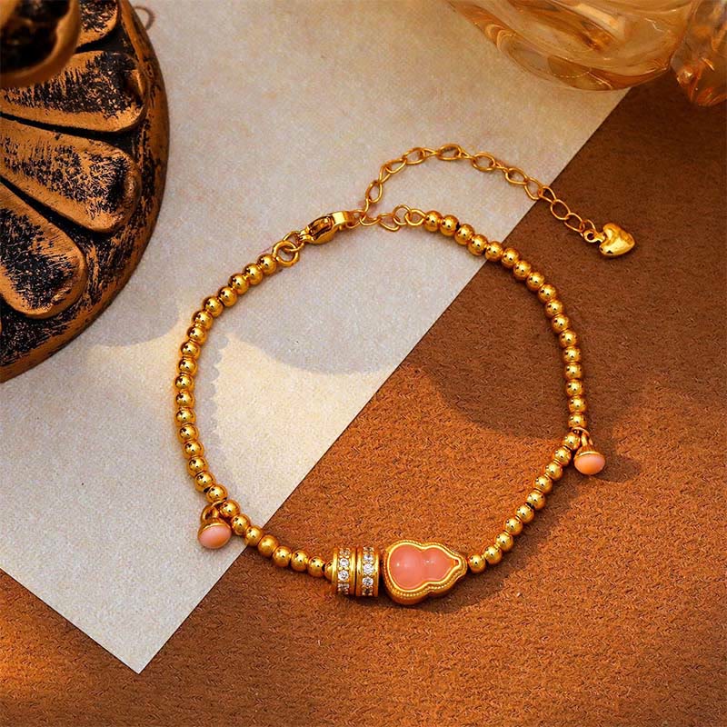 Bracciale della ricchezza con perline di zucca placcate in rame e ottone Buddha Stones - image 4
