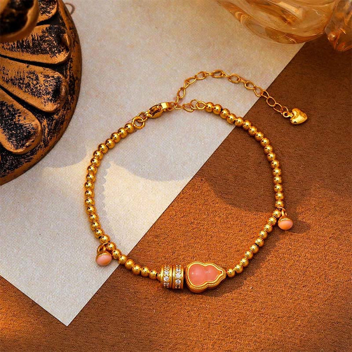 Bracciale della ricchezza con perline di zucca placcate in rame e ottone Buddha Stones - image 2