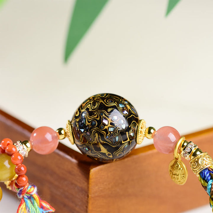 Braccialetto di protezione in pietra di occhio di tigre intrecciato a mano con perline di lacca tibetana Buddha Stones - image 10