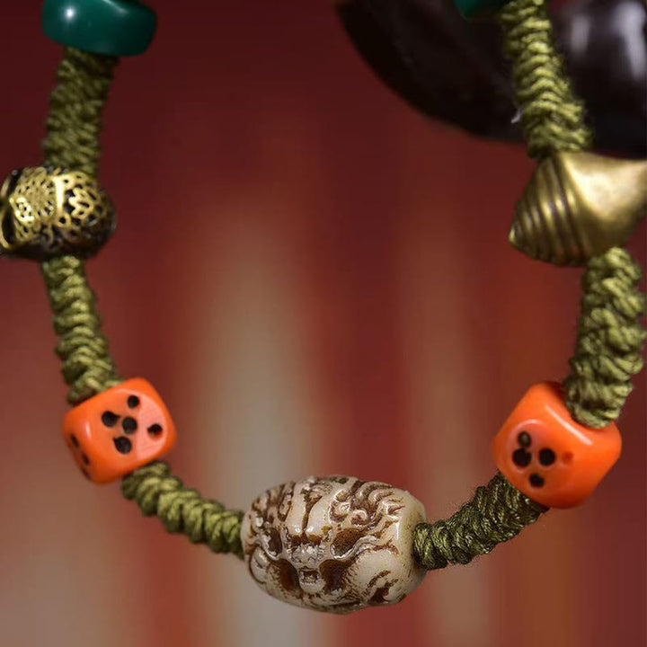 Braccialetto di corda fatto a mano con dadi e motivo drago tibetano di Buddha Stones - image 4