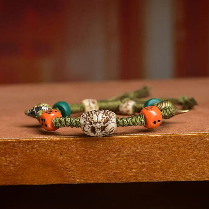Braccialetto di corda fatto a mano con dadi e motivo drago tibetano di Buddha Stones - image 3