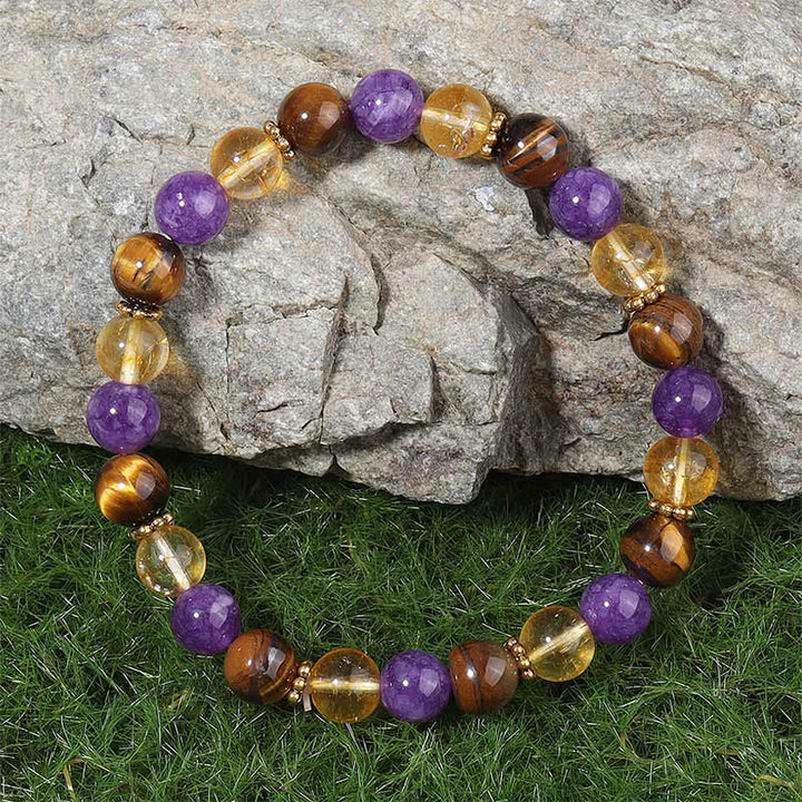 Braccialetto di guarigione con perline distanziatrici in Buddha Stones, ametista, occhio di tigre e citrino - image 1