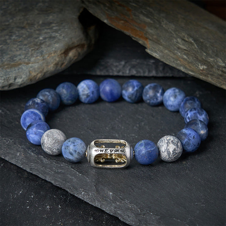 Bracciale dell'armonia Om Mani Padme Hum in pietra naturale di sodalite grigia di Buddha Stones - image 1