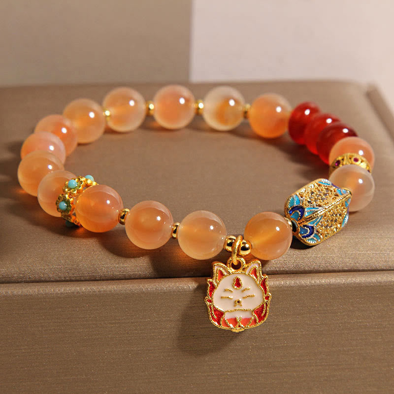 Braccialetto curativo in agata arancione caramellata naturale con volpe a nove code Buddha Stones - image 1
