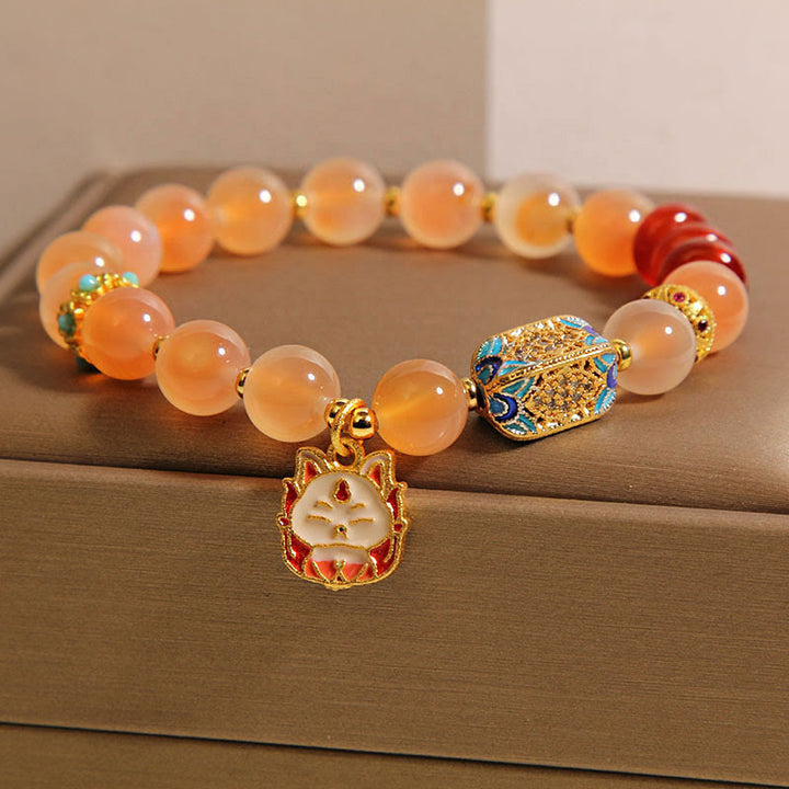 Braccialetto curativo in agata arancione caramellata naturale con volpe a nove code Buddha Stones - image 2