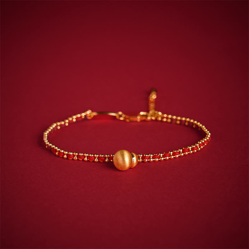 Bracciale Buddha Stones in corda rossa, rame e ottone, zucca, forza e ricchezza - image 1