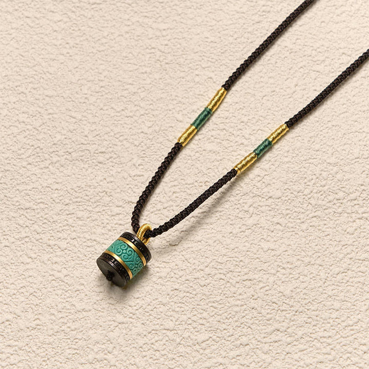 Collana con ciondolo della pace in legno di ebano e turchese Buddha Stones - image 3