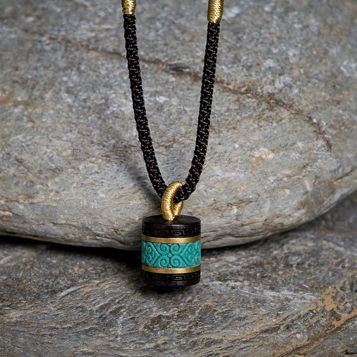Collana con ciondolo della pace in legno di ebano e turchese Buddha Stones - image 1
