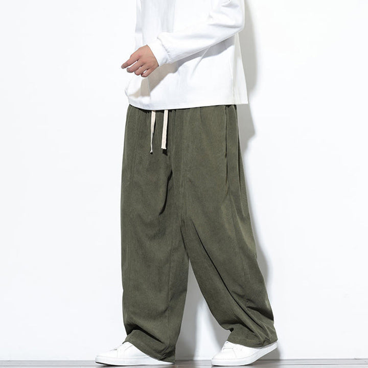 Pantaloni harem da uomo in puro velluto a coste con coulisse e tasche, con motivo Buddha Stones. - image 3