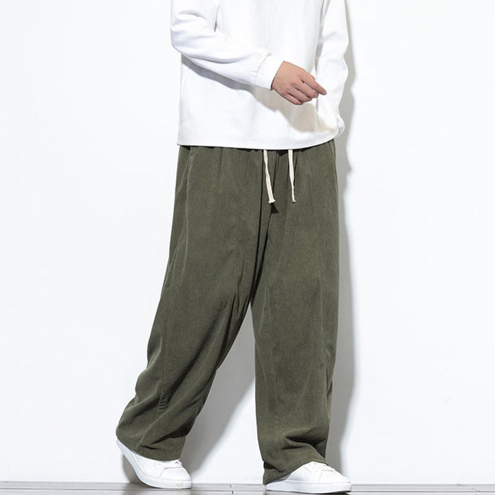 Pantaloni harem da uomo in puro velluto a coste con coulisse e tasche, con motivo Buddha Stones. - image 7