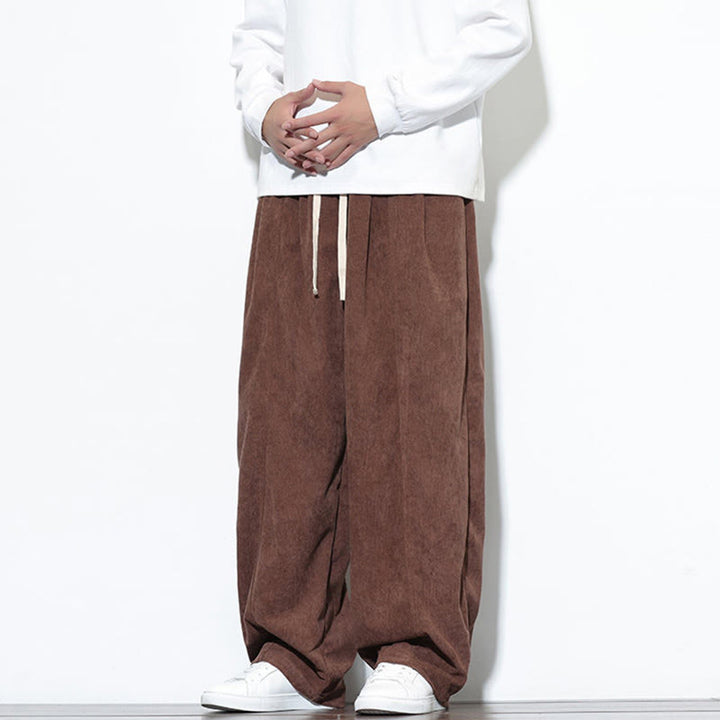 Pantaloni harem da uomo in puro velluto a coste con coulisse e tasche, con motivo Buddha Stones. - image 36