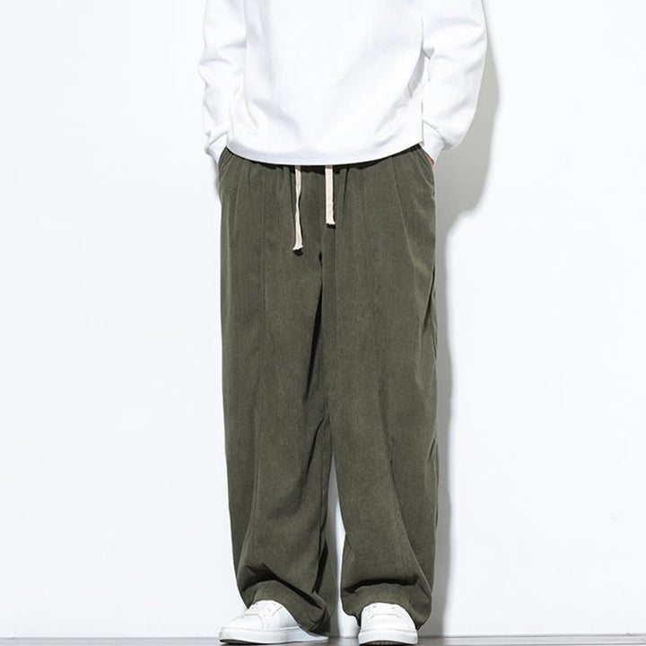 Pantaloni harem da uomo in puro velluto a coste con coulisse e tasche, con motivo Buddha Stones. - image 5