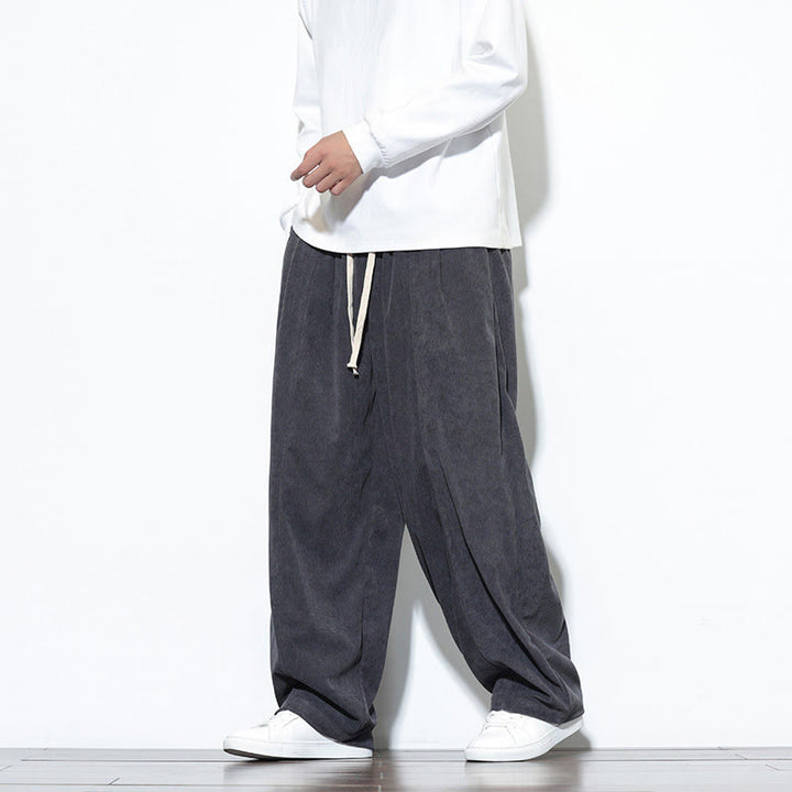 Pantaloni harem da uomo in puro velluto a coste con coulisse e tasche, con motivo Buddha Stones. - image 13