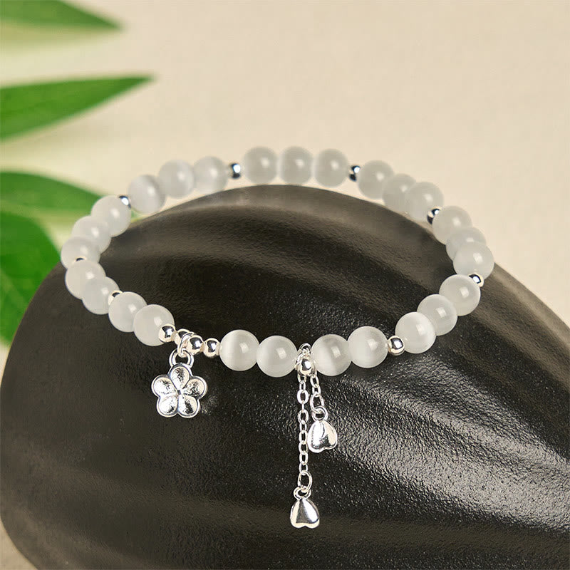 Bracciale della pace con fiori di ciliegio e occhio di gatto naturale Buddha Stones - image 1