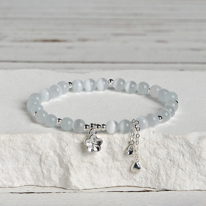Bracciale della pace con fiori di ciliegio e occhio di gatto naturale Buddha Stones - image 2