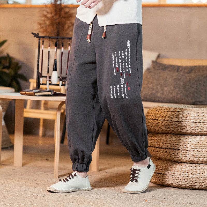 Pantaloni da uomo in cotone con tasche e motivo a caratteri cinesi ricamati con Buddha Stones - image 1