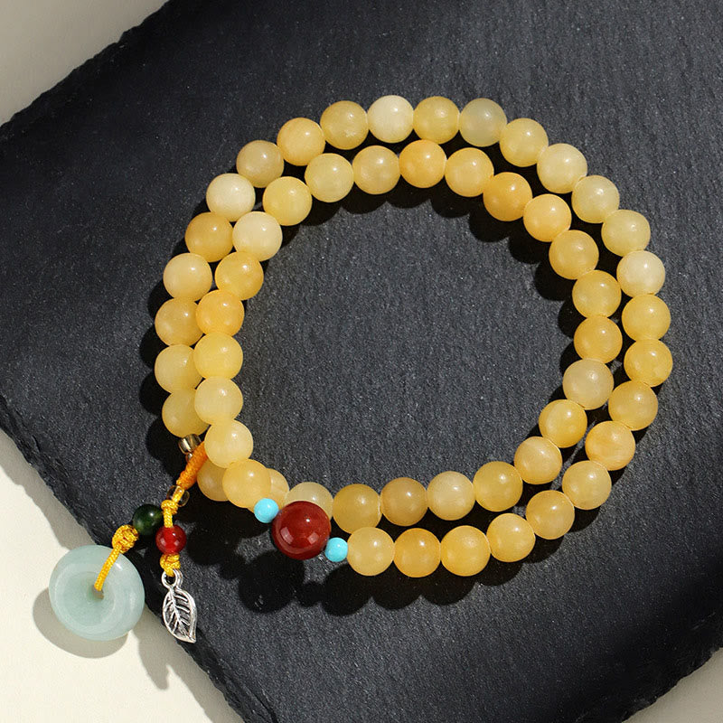 Bracciale della ricchezza con fibbia della pace a doppio giro in Buddha Stones e topazio - image 1