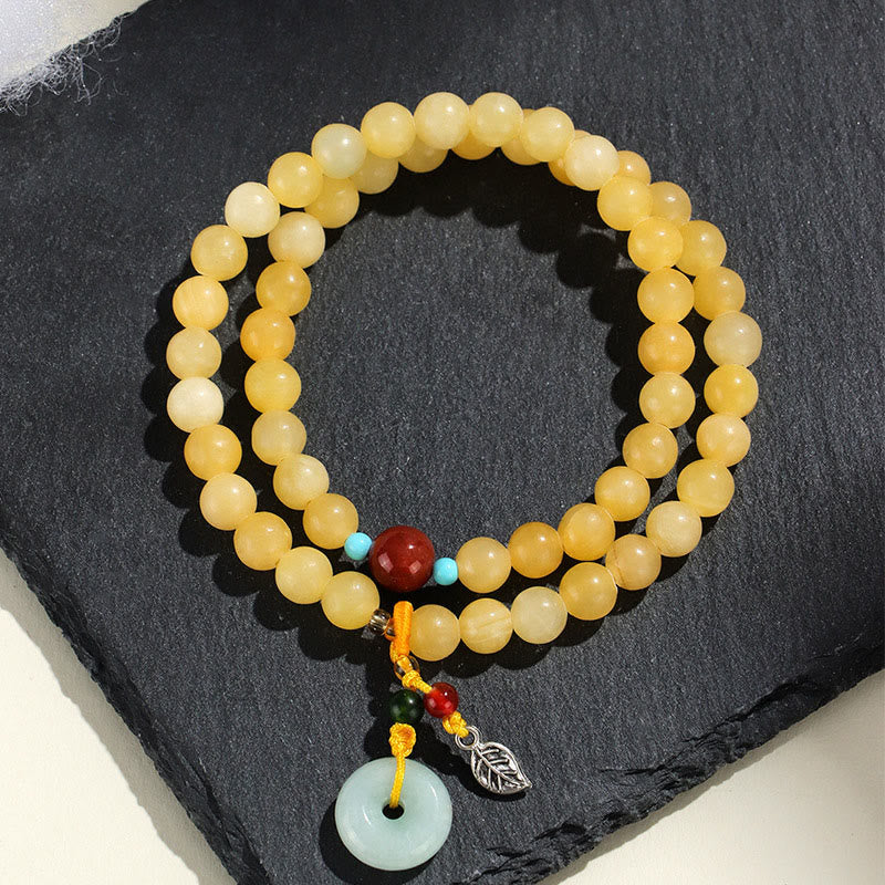 Bracciale della ricchezza con fibbia della pace a doppio giro in Buddha Stones e topazio - Topazio (circonferenza del polso: 13-15 cm) - image 0