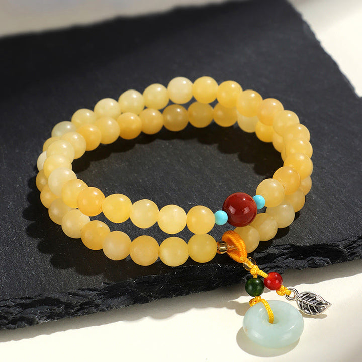 Bracciale della ricchezza con fibbia della pace a doppio giro in Buddha Stones e topazio - image 3