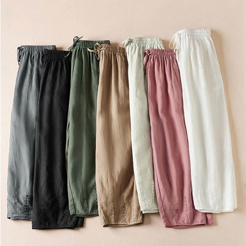 Pantaloni harem estivi con piccole decorazioni floreali e tasche, ispirati a Buddha Stones. - image 1