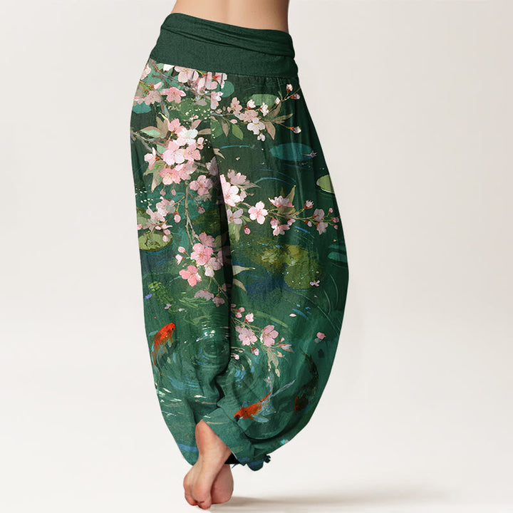 Pantaloni harem da donna con elastico in vita, in puro cotone, con Buddha Stones di ciliegio, pesci koi e foglie di loto - image 1