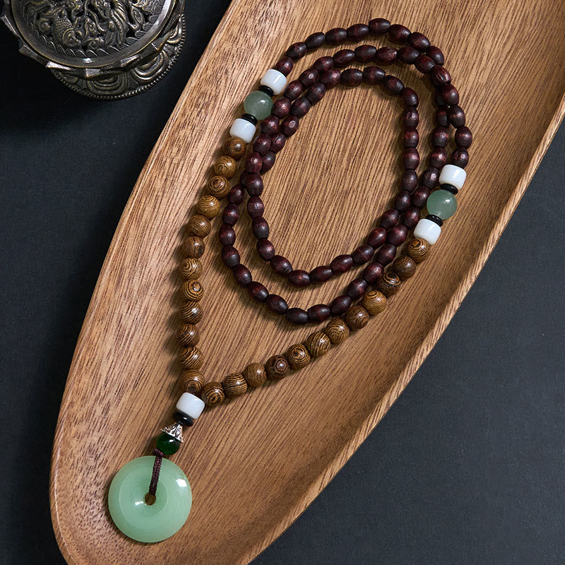 Collana con ciondolo Buddha Stones Wenge Wood Peace Buckle Balance Tranquility - Fibbia in legno di wengé e pace - image 0