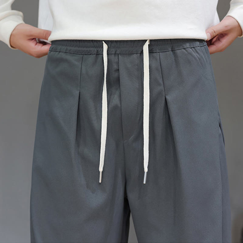 Pantaloni harem da uomo con tasche e gamba dritta, tinta unita, modello Buddha Stones Fall - image 9