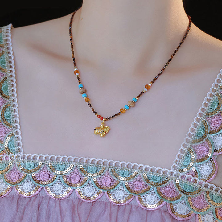 Collana con ciondolo con protezione per l'occhio di tigre Buddha Stones, anno dorato del cavallo - image 9