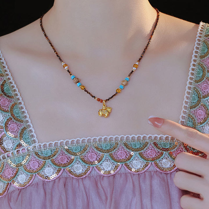 Collana con ciondolo con protezione per l'occhio di tigre Buddha Stones, anno dorato del cavallo - image 3