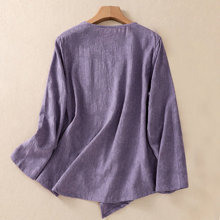 Camicia da donna a maniche lunghe con orlo irregolare e pieghe, stampa jacquard con motivo Buddha Stones. - image 1