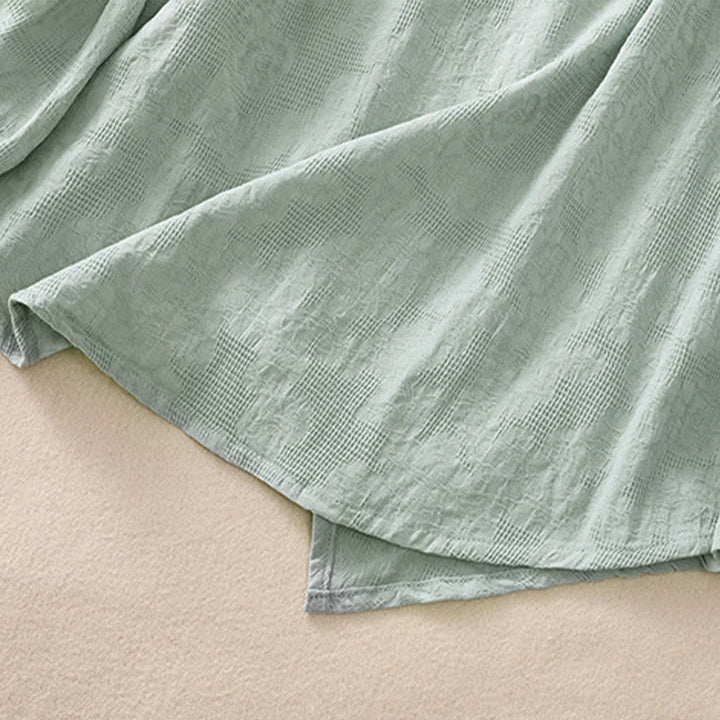 Camicia da donna a maniche lunghe con orlo irregolare e pieghe, stampa jacquard con motivo Buddha Stones. - image 39
