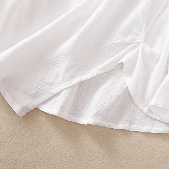 Camicia da donna a maniche lunghe con orlo irregolare e pieghe, stampa jacquard con motivo Buddha Stones. - image 15