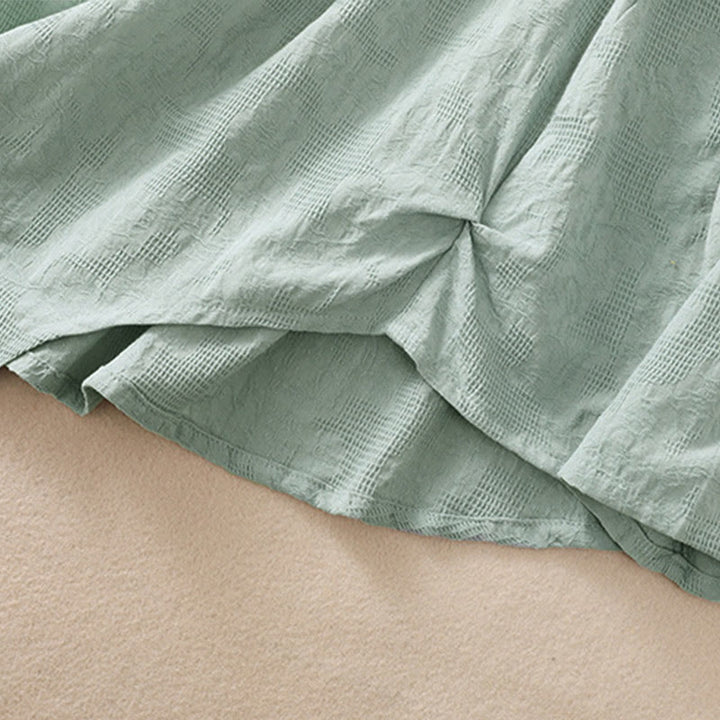 Camicia da donna in cotone a maniche lunghe con motivo a pieghe e orlo irregolare in jacquard Buddha Stones - image 37