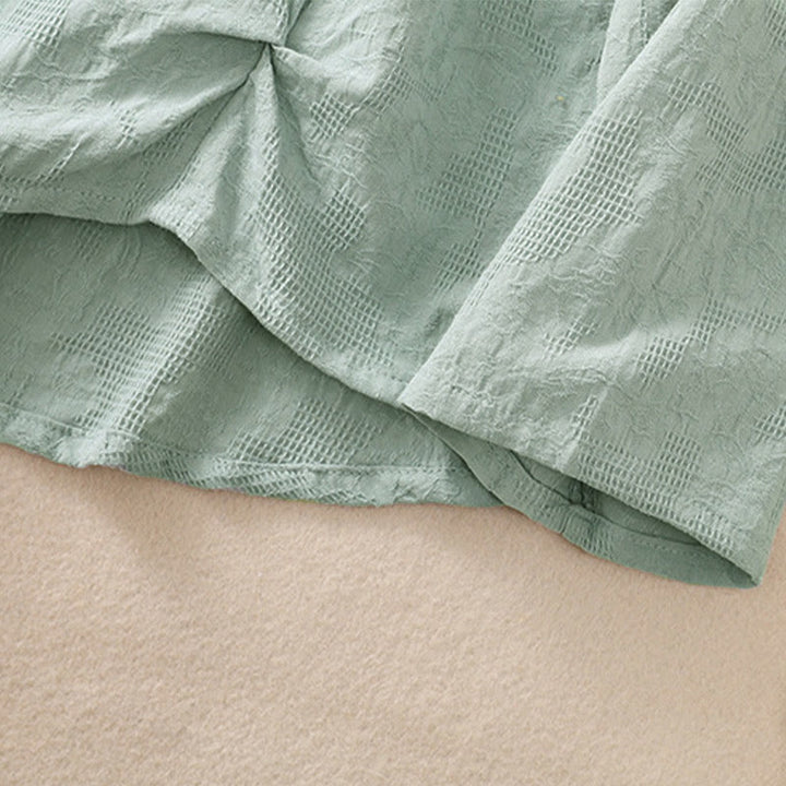 Camicia da donna in cotone a maniche lunghe con motivo a pieghe e orlo irregolare in jacquard Buddha Stones - image 38