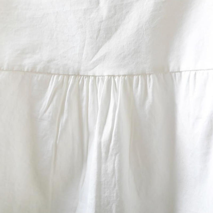 Camicia da donna in cotone a maniche lunghe con bottoni e motivo a pieghe a fisarmonica bianca Buddha Stones Fall - image 6