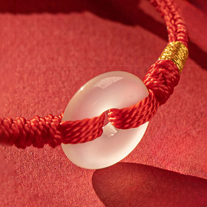 Bracciale intrecciato con fibbia della pace in calcedonio bianco Buddha Stones - image 3