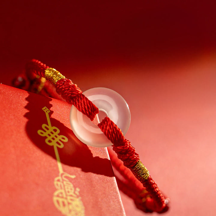 Bracciale intrecciato con fibbia della pace in calcedonio bianco Buddha Stones - image 2