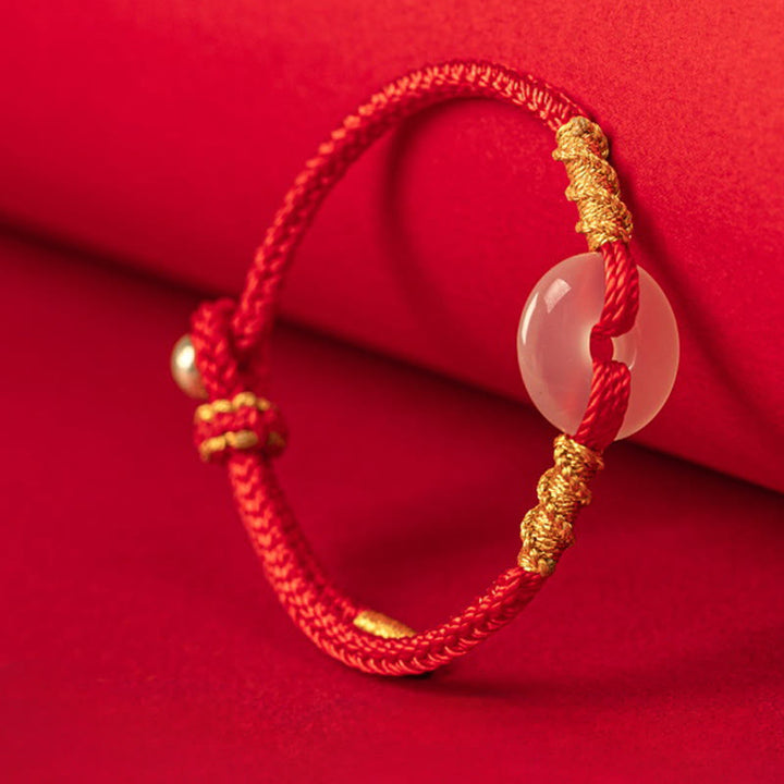 Bracciale con nodo di corda di collegamento con fibbia della pace in calcedonio bianco Buddha Stones - image 1