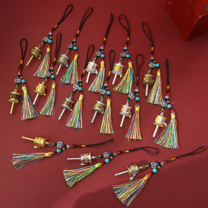 Portachiavi con ruota di preghiera Buddha Stones Om Mani Padme Hum e nappe colorate Purezza - image 15