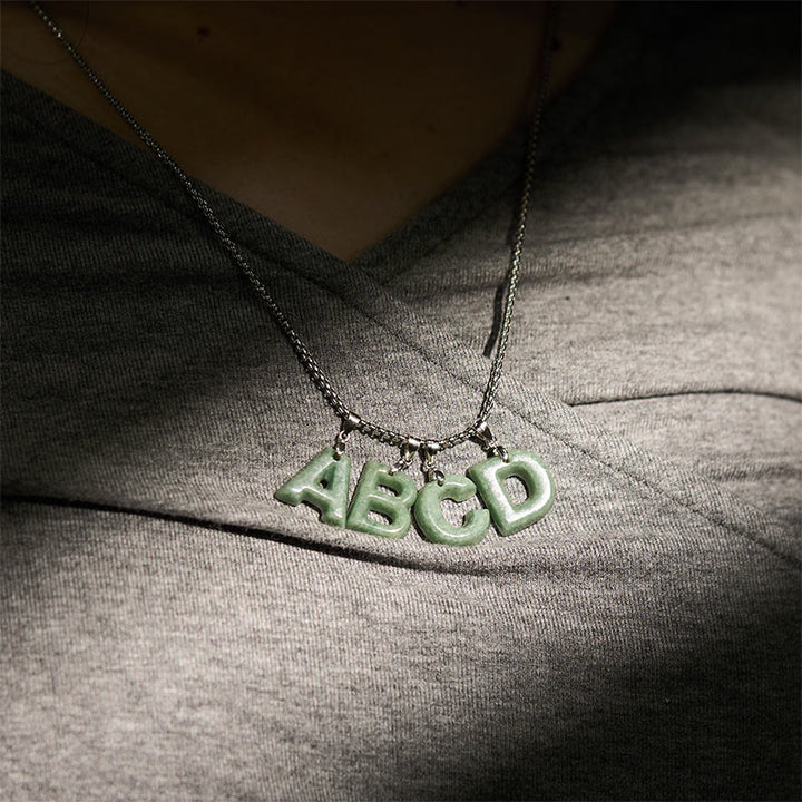 Collana con ciondolo della prosperità in acciaio al titanio con lettera AZ naturale Buddha Stones - image 40